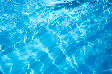 Fototapeta na wymiar Blue water surface with ripples and bubbles reflections of light