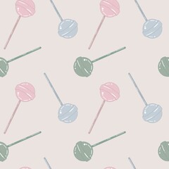 Seamless pattern with lollipops on a beige background. Suitable for wrapping paper and all kinds of prints. Endless ornament with sugar candy. Wallpaper and bed linen print.