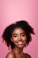 Portrait of young happy woman looks in camera. Skin care beauty, skincare cosmetics, dental concept isolated over pink background.