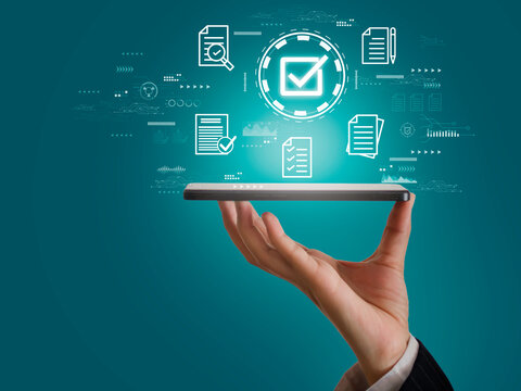 Businessman's hands using laptop with correct sign and document icons for online approval Concept of quality assurance and guarantee