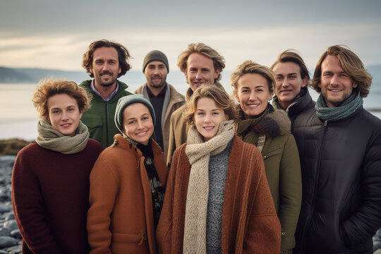 Portrait of multi-generation family group on winter beach vacation.