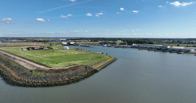 aerial drone view of a sea port in the province of Zeeland, The Netherlands. Also leading into a the sixth structure of the Delta Works . Port for businness liek fishery, leisure sailing, and