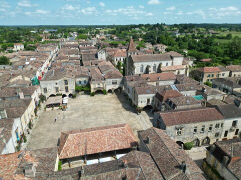 Monpazier  town square France drone,aerial low angle