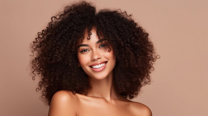 Beauty portrait of african american girl with clean healthy skin on beige background. Smiling dreamy beautiful black woman.Curly hair in afro style