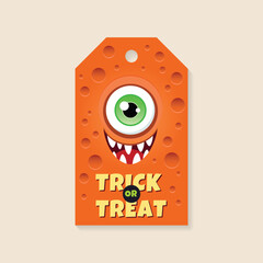 Halloween gift tag template. Funny card with a cartoon smiling monster on an orange background. Vector 10 EPS.