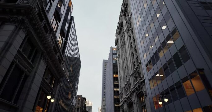 Business district building with wall mirror with cloudy sky
