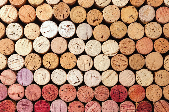Collection of wine cork from white and red wine, natural texture bottle stoppers top view, colorful background from closeup wooden corks. Natural textured stoppers Winery, winemaking concept