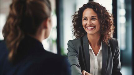 copy space, stockphoto, Happy mid aged business woman manager handshaking at office meeting. Smiling female hr hiring recruit at job interview, bank or insurance agent, lawyer making contract deal wit - obrazy, fototapety, plakaty