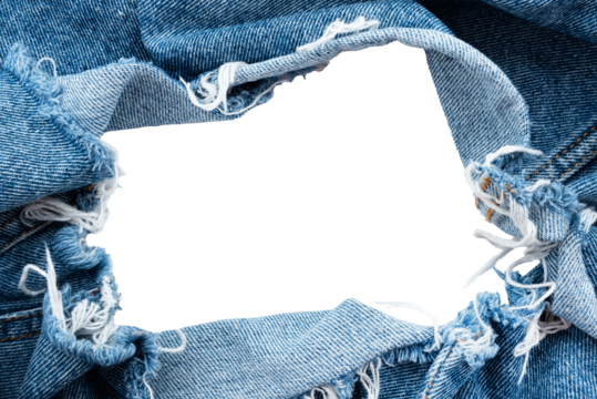 Hole in denim on a white background. Ripped jeans