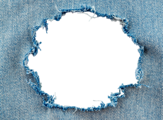 Hole in denim on a white background. Ripped jeans