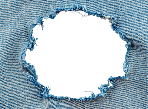 Hole in denim on a white background. Ripped jeans