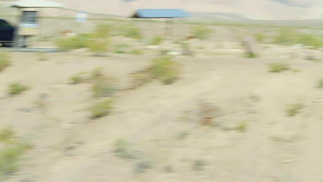 Flying man flys fast through desert and insane speeds. 