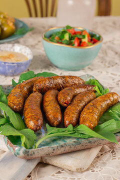 Mumbar is a type of sausage of middle eastern origin that is made with mutton, rice, black pepper, salt and cinnamon stuffed into an intestine casing - after the sausage has been cooked by boiling. 