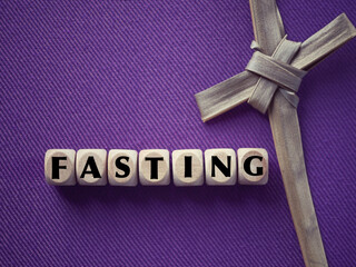 Christianity concept about Good Friday, Lent Season and Holy Week. FASTING written on wooden...