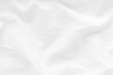 Wrinkled white cotton fabric clothes texture background.