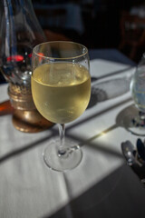 fisheye view of White wine in a glass on a table