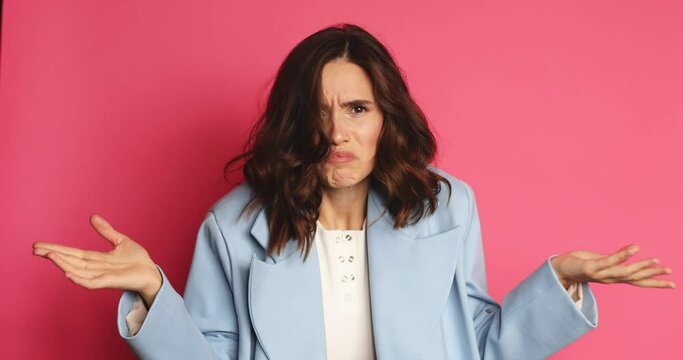 Need to think! Pensive doubting woman in jacket pondering and imagining in mind, wondering difficult solution, feeling confused, not sure about choice. Studio shot isolated on pink background.