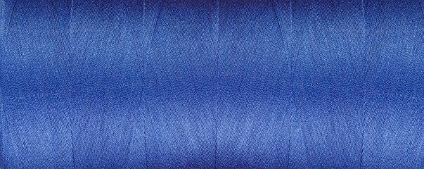 texture of threads for a sewing machine blue colors on a white background