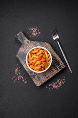 Delicious pickled honey mushrooms with salt and spices in a ceramic plate