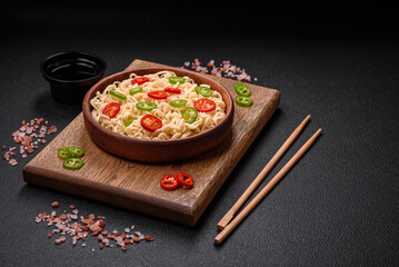 Delicious Asian cuisine dish with rice noodles, peppers, mushrooms and spices