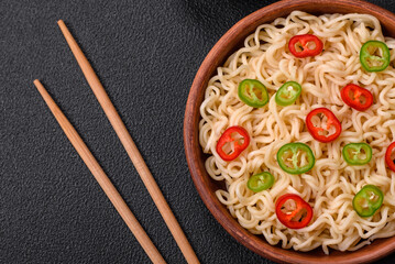 Delicious Asian cuisine dish with rice noodles, peppers, mushrooms and spices