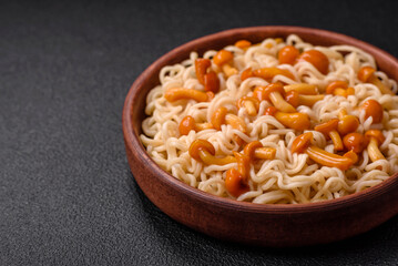 Delicious Asian cuisine dish with rice noodles, peppers, mushrooms and spices