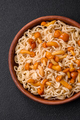 Delicious Asian cuisine dish with rice noodles, peppers, mushrooms and spices