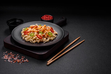 Delicious Asian cuisine dish with rice noodles, peppers, mushrooms and spices