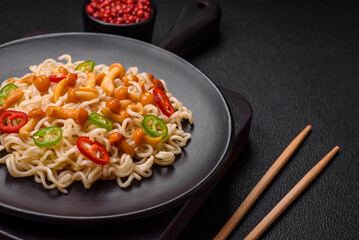 Delicious Asian cuisine dish with rice noodles, peppers, mushrooms and spices