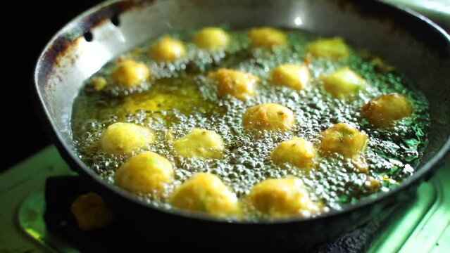 Making a padoka or pakora by hand a young woman in Indian homes