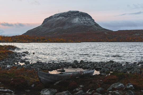 abandoned boat on the shore of a lake near Saana Mountain in Finland