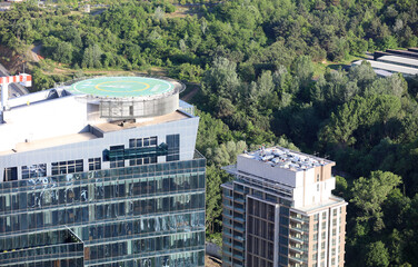 Aerial view of helipad. Helicopter landing pad on rooftop on skyscraper, high-rise office building in İstanbul Downtown, Turkey. Financial district and business centers in smart city in Turkey.