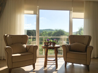 living room with beauitiful sunrise and mountain backdrop