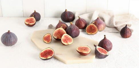 Fresh ripe figs on light table