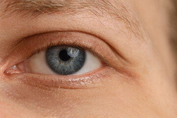 Young man with blue eyes, closeup