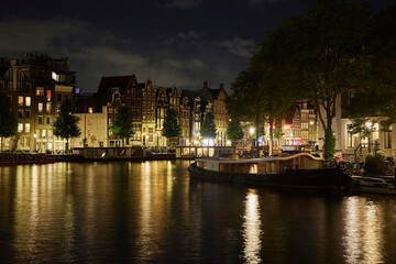 Majestic Amsterdam at night. Summer city landscape. Panorama