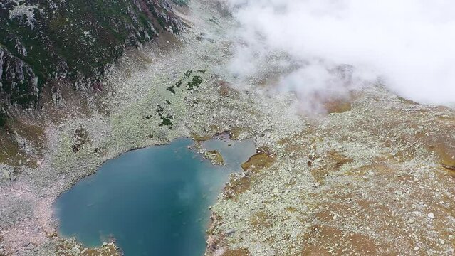 Flying with a drone through the clouds on the magnificent peaks of the Altiparmak Mountains in Rize. High peaks on a wonderful morning, natural landscape. Kackar, Rize.
