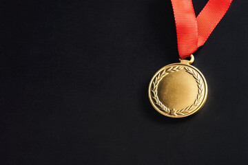 Gold Medal on Black Background with Copy Space