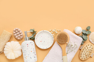Composition with bath supplies, gypsophila flowers and eucalyptus branches on color background