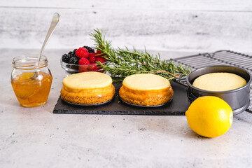 Mini cheesecakes, and ingredients for the dessert topping close-up