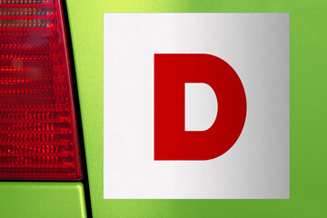 D plate on the back of a learner driver's car