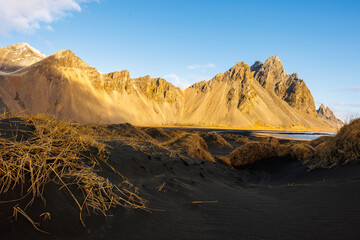 Magnificent natural location on Scandinavian peninsula with vestrahorn highlands and black sand beach in Stokknes. Massive slopes and amazing shoreline in Iceland, paradise scene.
