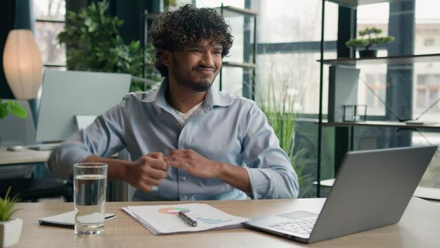 Arabian Hispanic businessman anxious desperate office worker annoyed man work financial data analysis write strategy business audit graphs crumpling sheet of paper throw away burnout failure mistake