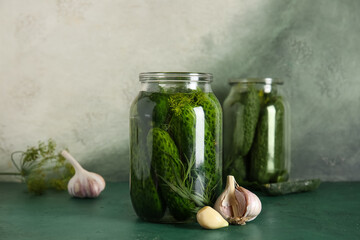 Jar with fresh cucumbers for canning on table