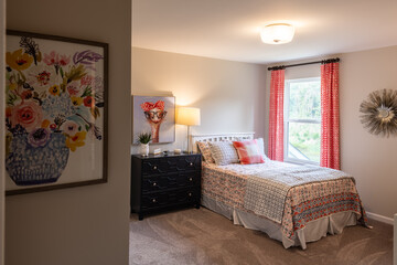 Interior of a furnished contemporary bedroom. Home decorating, bed and breakfast, or real estate concept.