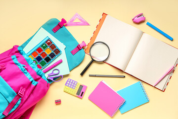 Composition with stylish school backpack and different stationery on color background