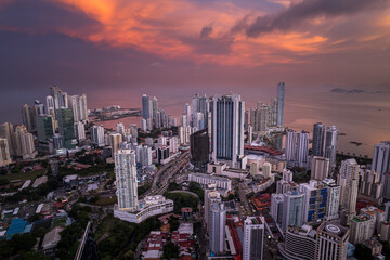 Beautiful aerial view of Panama City, its skyscraper buildings, the Cinta Costera at Sunset