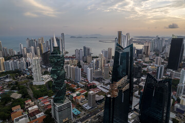 Obraz premium Beautiful aerial view of Panama City, its skyscraper buildings, the Cinta Costera at Sunset