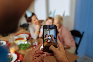 Shot of a phone taking photo of a family