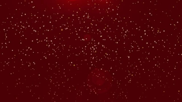 animation of golden particles on red background, christmas